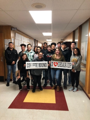 students in hall with sign