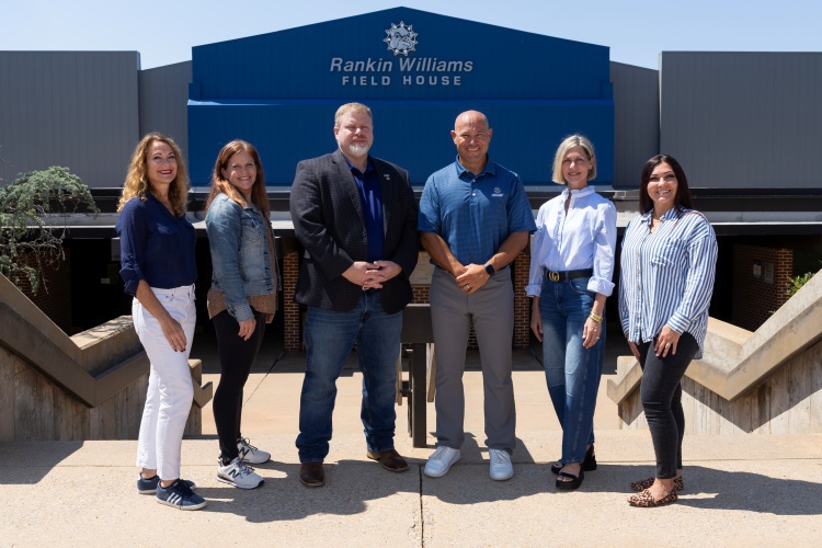 Kinesiology Faculty outside building.
